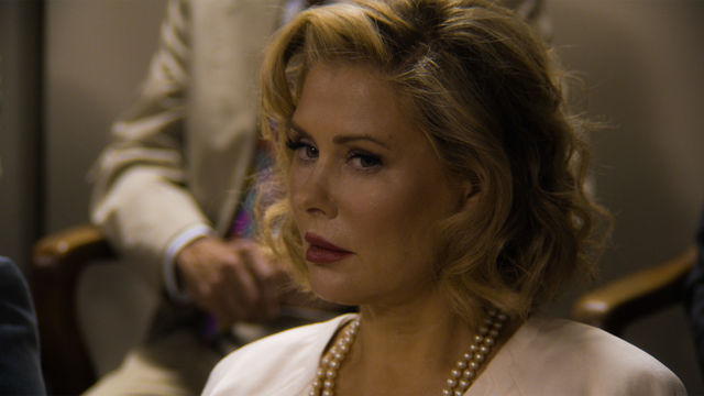 Close-up of blond White woman sitting in a jury box